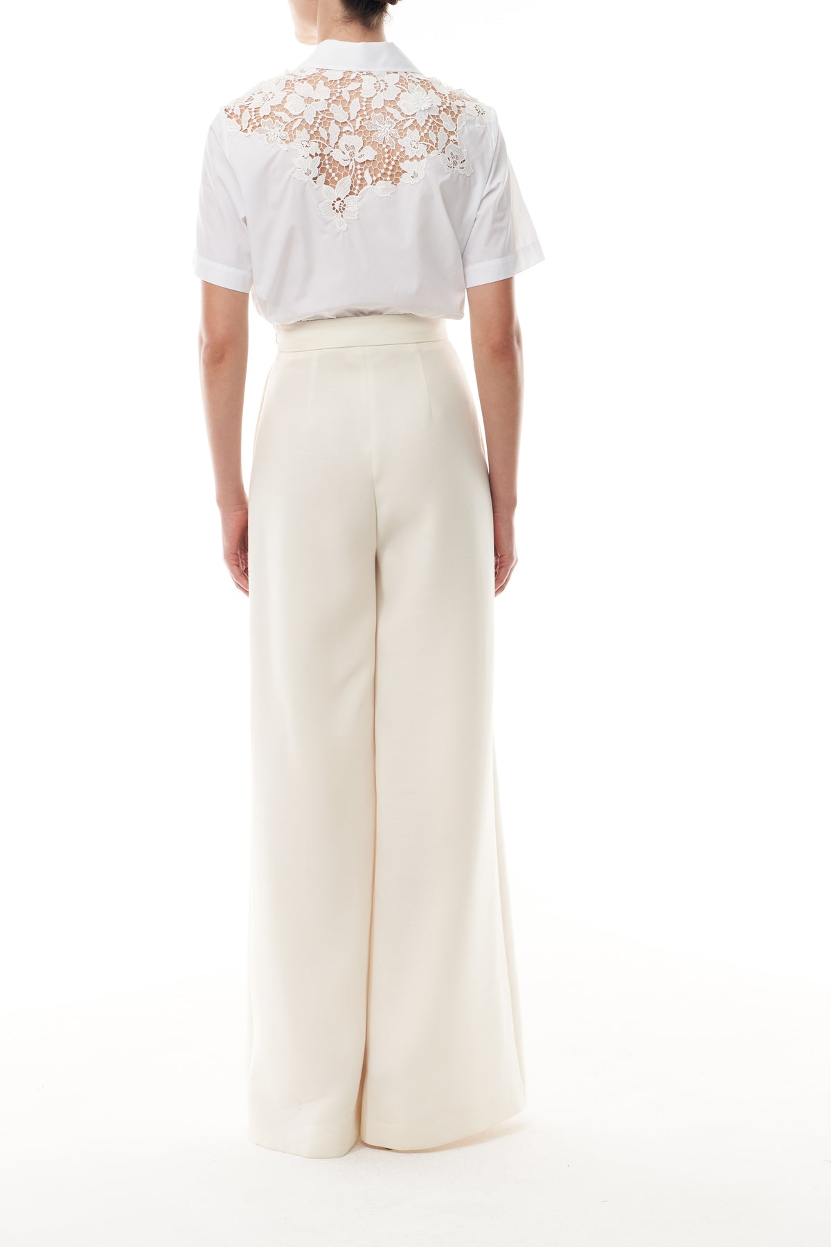 Collared, button-front short sleeve shirt in silk white poplin fabric with lace detailing at shoulders and back - back.